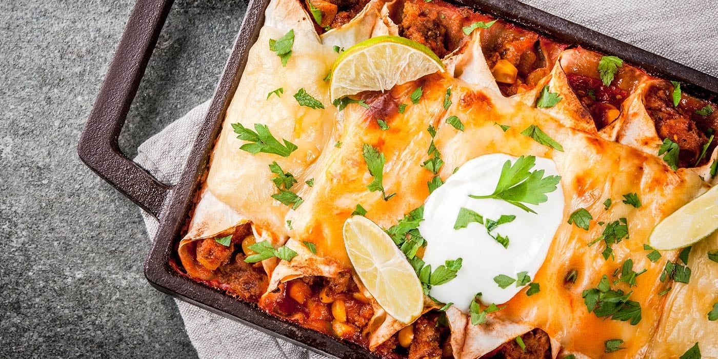 cheesy enchiladas in baking dish