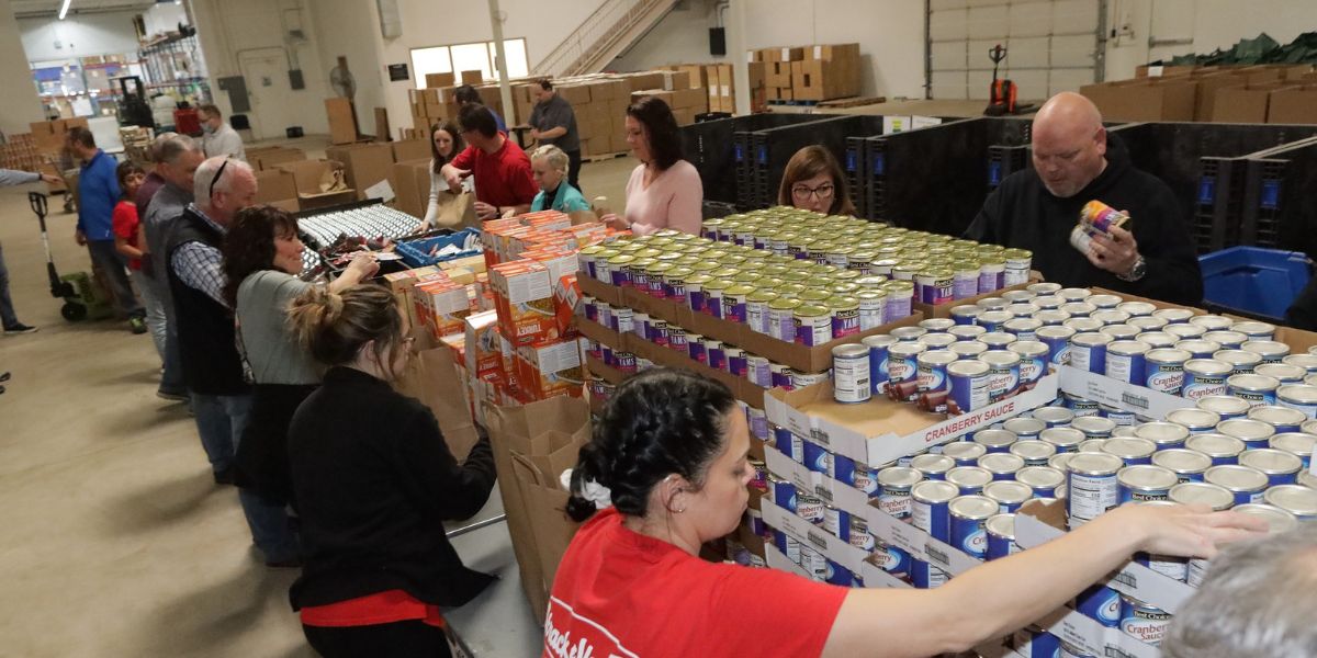 Strack & Van Til employees pack donation bags