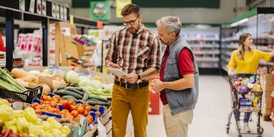 Grocery store manager trains employee