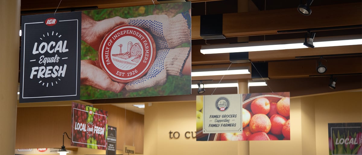 IGA Local Equals Fresh sign hangs in the store