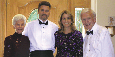 Buren Haggai, left, and family, including Dr. Tom on right