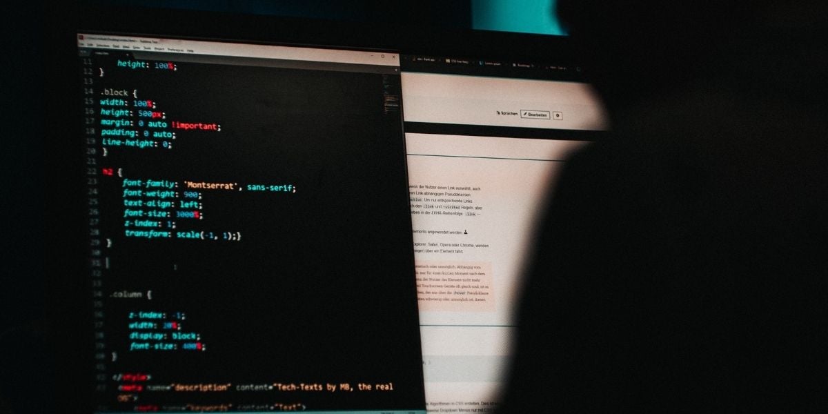 Ransomware: A hacker codes on a desktop computer