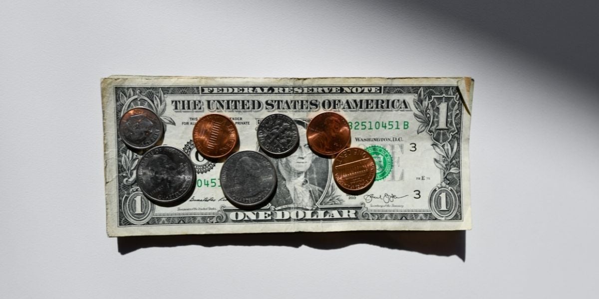 dollar bill with coins