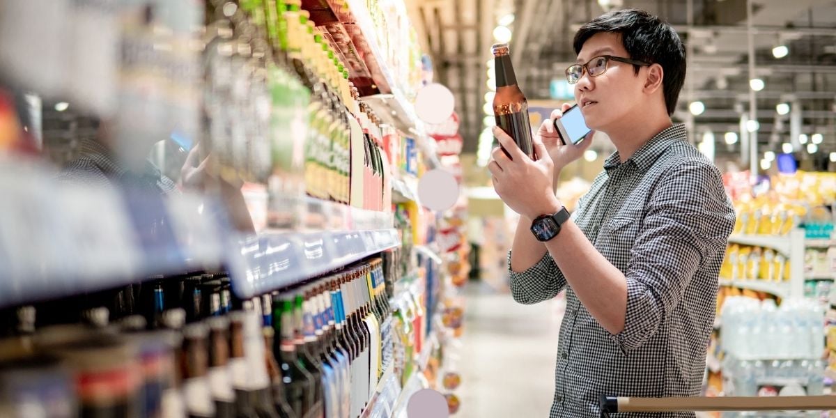 man shops for beer 