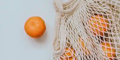 reusable shopping bag with oranges