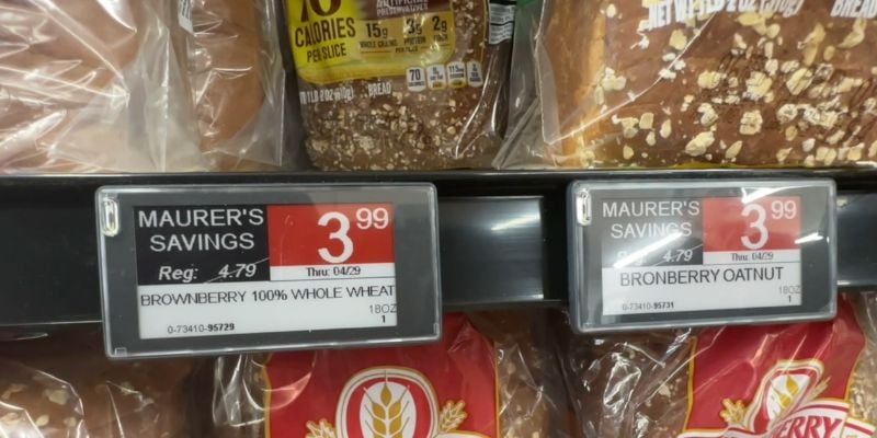 Electronic shelf label at Maurer's Market for Brownberry 100% whole wheat; regularly $4.79, on sale for $4.99