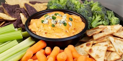 Hellmann's Buffalo Chicken Dip with chips, celery, carrots, broccoli