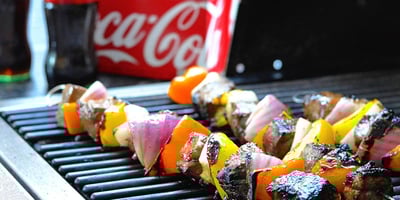 Kebabs on the grill and Coca-Cola 