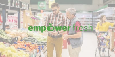 EmpowerFresh logo on photo of grocery employees in the 