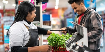 a cashier and customer interact