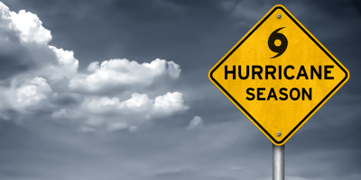 Hurricane Season sign amid storm clouds