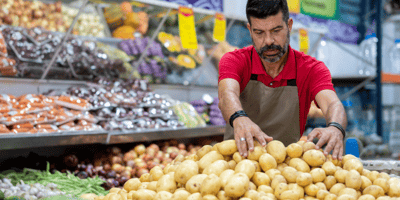 employee handling potatoes
