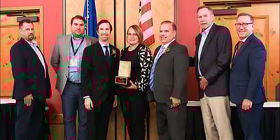 Center: Nick, Kari, Greg Hansen accept Wisconsin Grocers Association Award