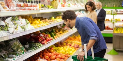 Grocery shoppers in produce