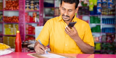 grocer answering phone