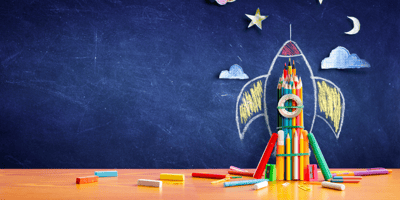 Rocketship drawn on chalkboard