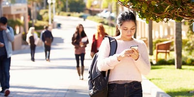 student walks on campus