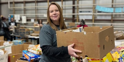A woman collects food donations for Harvest Hope Food Bank from Kingstree IGA