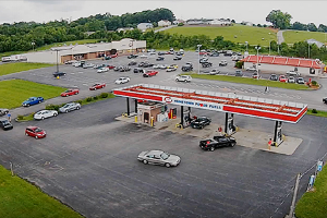Line of cars heading in to gas station