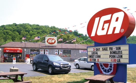 iga storefront with parking lot